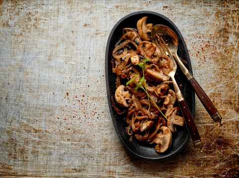 Tasty Side Dish Of Grilled Onions And Mushrooms