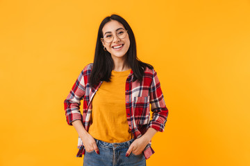 Photo of pleased brunette woman smiling while looking at camera