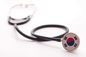South Korea healthcare concept. Medical stethoscope with country flag