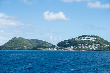 ocean view on to land with many houses