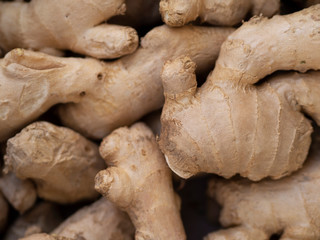 Heap of ginger roots on a village market. Bio Food On A Health Food Store Counter