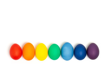 Easter eggs in rainbow colors isolated on the white background. Copy space. Flat lay