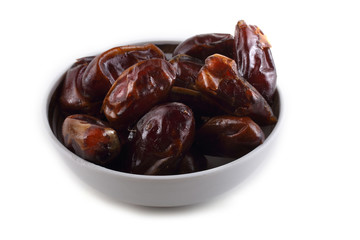 Date fruits on saucer isolated on white
