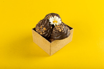 Chocolate pralines in a cardboard box