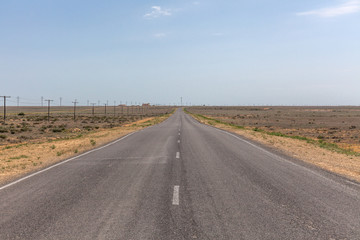asphalt road along the Kazakh steppe. ustyurt. Selective focus