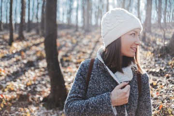 Beautiful smiling young woman autumn portrait outdoors in nature