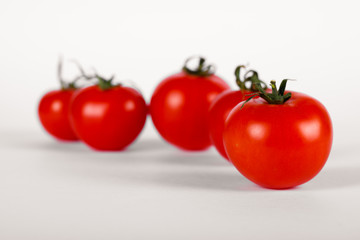 Fresh tomatoes on white background