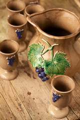 Fototapeta na wymiar Ceramic jug and cups for wine