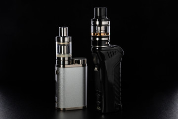 electronic cigarettes or vaping devices on black background