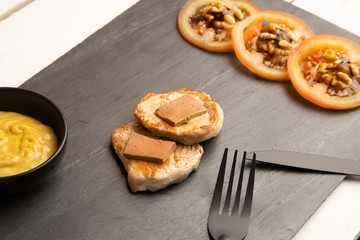 Pork tenderloin dish with pate and tomato and walnut salad