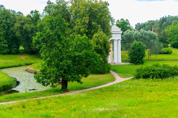 View of a valley of the Slavyanka river and Temple of Friendship pavilion in Pavlovsk park, Russia