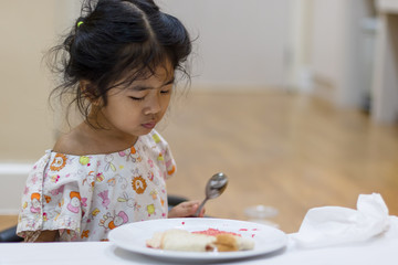 Little asian girl bored of having to be hospitalized because of illness.