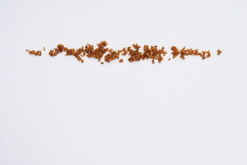 Muscovado sugar isolated on a white background. Abstract pattern. Top view