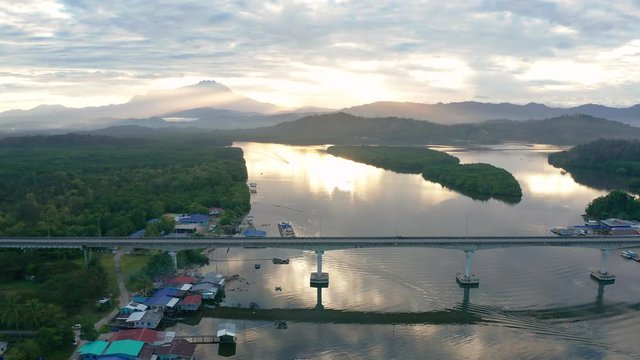 Aerial 4K footage of beautiful sunrise landscape scenery at Mengkabong River Tuaran, Sabah, Malaysia 