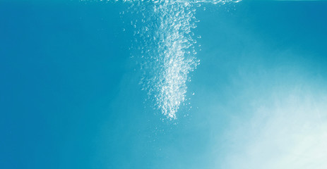 Water bubbles in the blue water .Abstract oxygen bubbles in the water.Water bubbles on blue background.