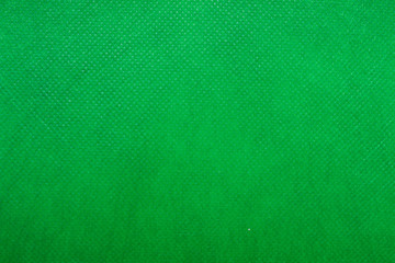 Fototapeta na wymiar background texture of a green fabric