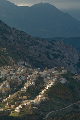 Obraz premium Panoramic view from mount Profitis Ilias over the village of Olympos in the island of Karpathos in Greece