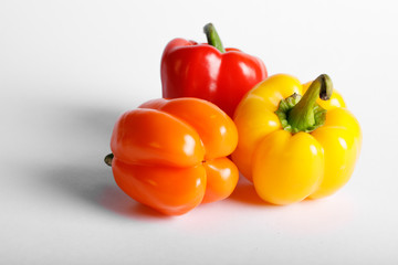 Tricolor peppers isolated on white