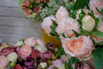 Artificial bouquet of flowers. Bouquet of mixed flowers. Floral shop, flower market. Concept of greeting, presents..