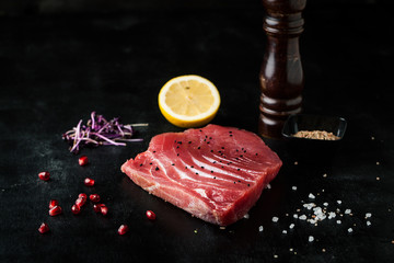 Raw tuna steak with spice and lemon