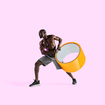 African-american Athlete With Duct Tape On Pink Background. Copyspace For Your Proposal. Modern Design. Contemporary Artwork, Collage. Concept Of Sport, Office, Hard Work, Dreams, Business, Action.