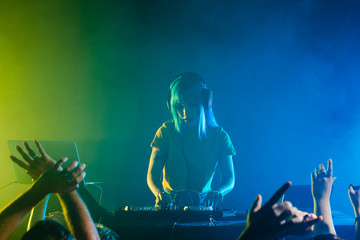 Clubbing with female dj mixing for the crowd
