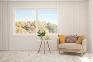 White stylish minimalist living room with armchair and autumn landscape in window. Scandinavian interior design. 3D illustration