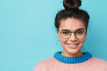 Image of cheerful beautiful woman smiling and looking at camera