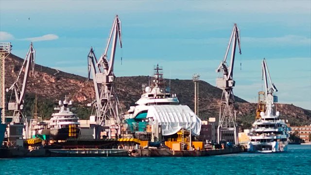 Dry dock servicing cargo ship, Industrical logistics concept, Long shot