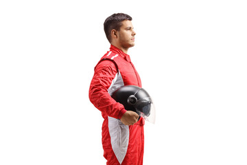 Racer in a red jumpsuit standing and holding a halmet