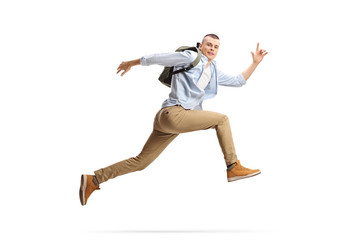 Fototapeta Male student with backpack jumping obraz