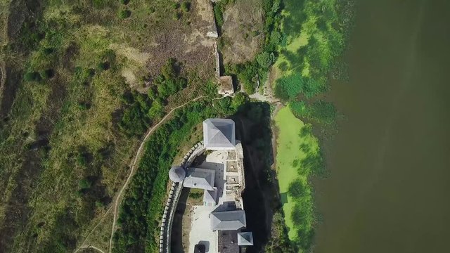 Aerial view of medieval castle near the river. Hotyn Castle in Ukraine