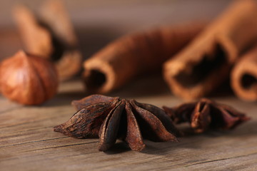 fragrant cinnamon sticks and star anise on a wooden surface