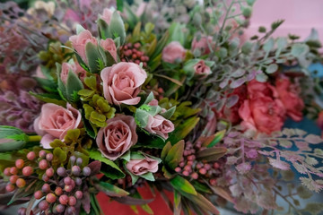 Artificial flower composition in floral shop. Floral theme, making bouquets.
