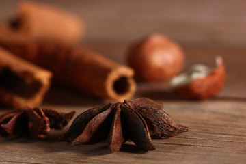 fragrant cinnamon sticks and star anise on a wooden surface