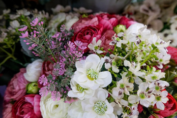 Obraz na płótnie Canvas Artificial flower composition in floral shop. Floral theme, making bouquets.