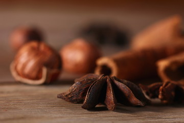 fragrant cinnamon sticks and star anise on a wooden surface