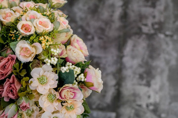 Artificial flower composition in floral shop. Floral theme, making bouquets.