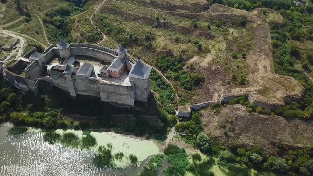 Aerial view of medieval castle near the river. Hotyn Castle in Ukraine