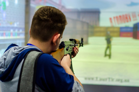 Guy shooting in virtual shooting gallery