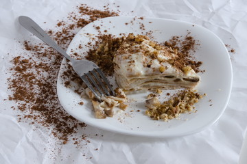 Composition a piece of cake with nut sprinkles