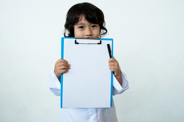 Photo of kid doctor with clipboard on white background