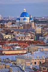 Fototapeta na wymiar Trinity Cathedral against the rooftops. St. Petersburg