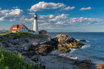 Fototapeta na wymiar Portland Head Lighthouse at sunset in Cape Elizabeth, New England, Maine, USA. 