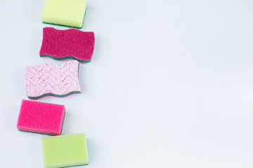 on a white background sponges of different colors and sizes