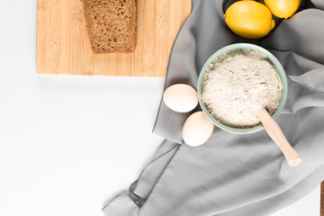 Slice of bread, flour and eggs on the table