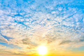 sunset sky landscape background natural color of evening cloudscape with setting sun light coming through clouds ultra wide view