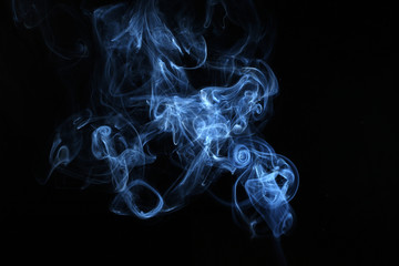 Fototapeta premium The abstract picture of the smoke. made by usage of the flash against black background. 
