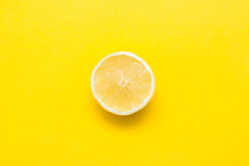 Lemon slice on yellow background. Top view. Copy, empty space for text