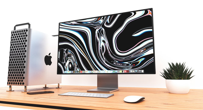 Mac Pro 2019 computer with Pro Display XDR by Apple on wooden table in office interior
